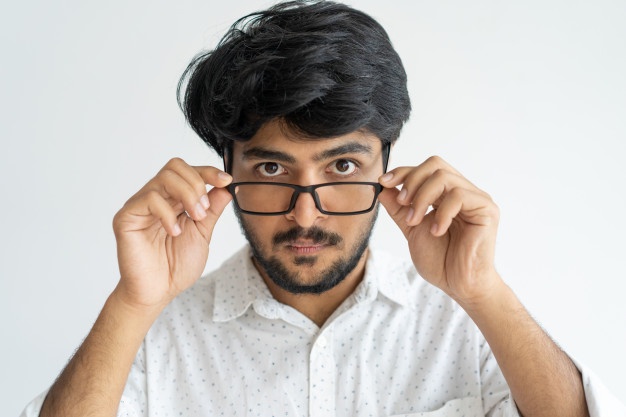 amazed intelligent indian man adjusting glasses believing his eyes 1262 14119