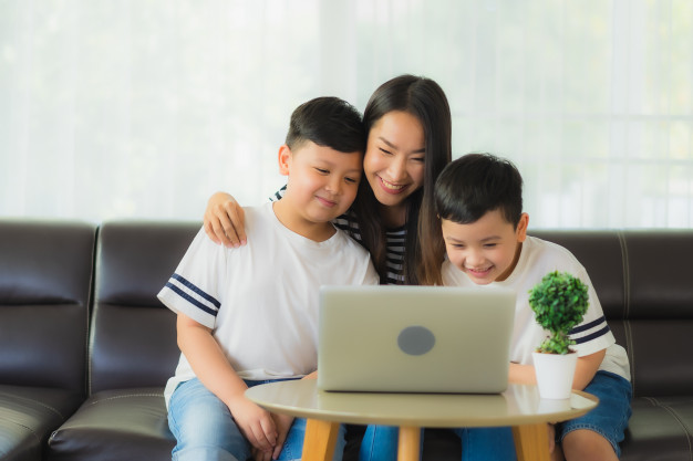 beautiful young asian woman mom with her sons using laptop 74190 10401