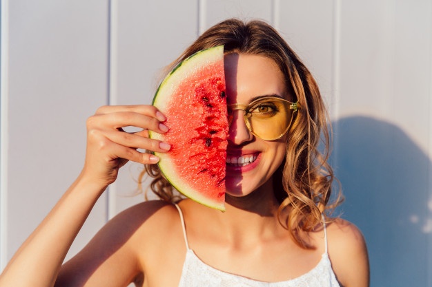 funny woman sunglasses hiding half her face with piece watermelon 8353 6801