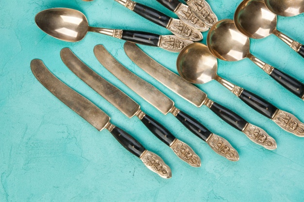 brass spoons knives concrete background 110491 963