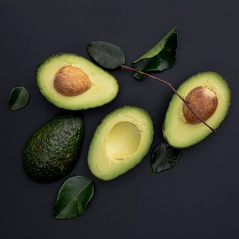 flat lay avocado with pit leaves 23 2148426522