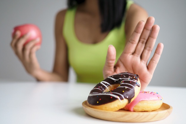women push donut plate that is mixture trans fat choose hold apple eat junk food diet concept 112699 176