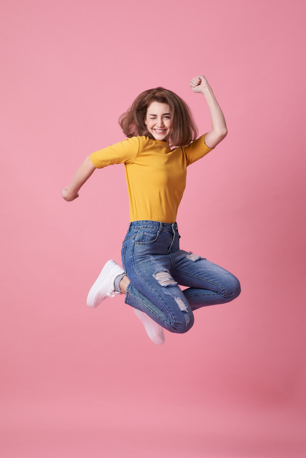 joyful young woman yellow shirt jumping celebrating 74952 246