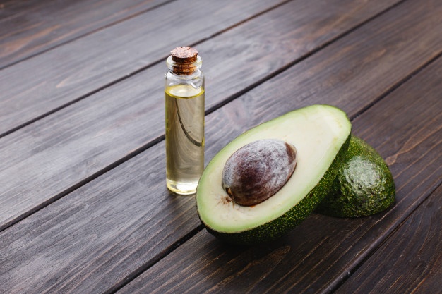little bottle with oil avocado stand wooden table 8353 7044