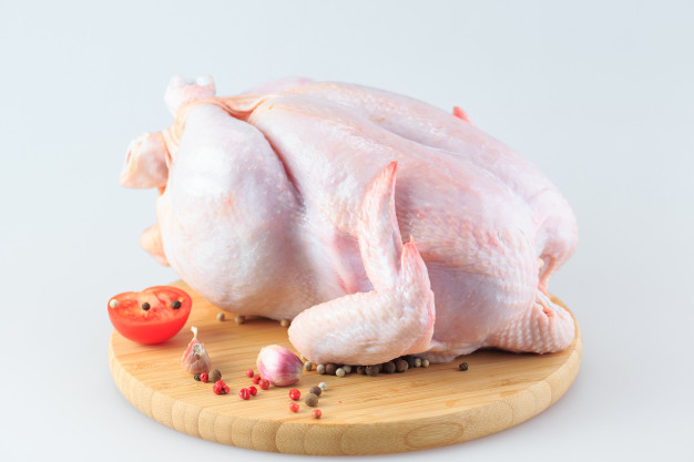 raw chicken carcass cutting board isolated white 109285 1132
