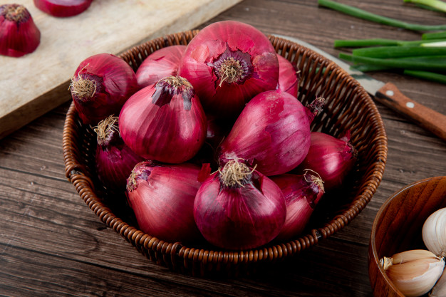 side view basket full red onions wooden background 141793 5655