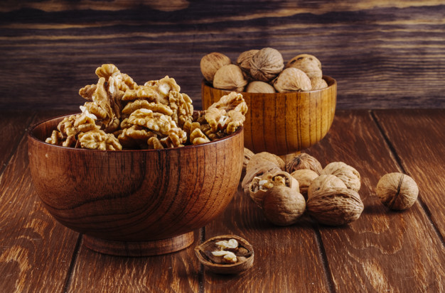 side view walnuts wooden bowl dark rustic background 141793 7278