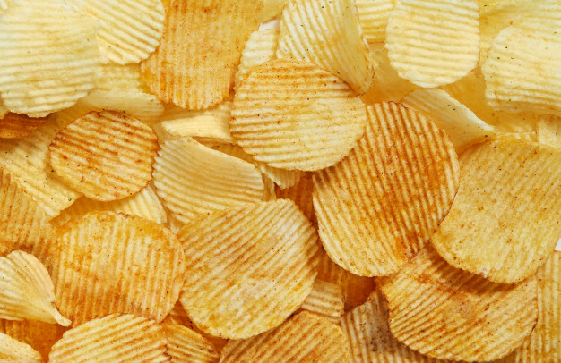 slices golden chips with stripes lying slides background texture view from 117406 401