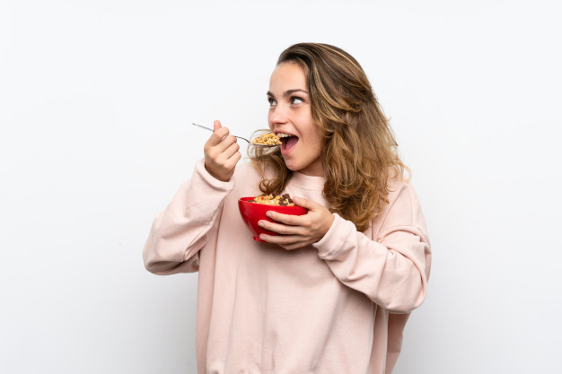young blonde woman holding bowl cereals 1368 51431