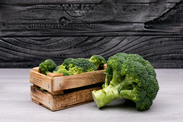 bunches broccoli wooden box near whole fresh broccoli 176474 413