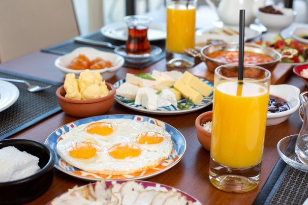 front view breakfast table with eggs buns cheese fresh juice restaurant during daytime food meal breakfast 140725 25904