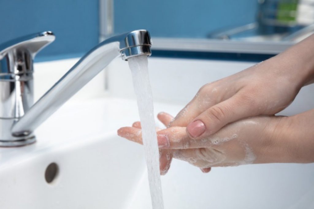 woman washing hands carefully bathroom close up prevention infection flu virus spreading 155003 5515 copy 1280x853