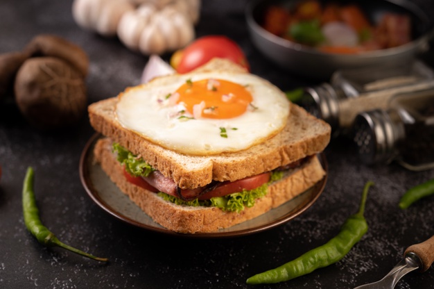 breakfast sandwich made with bread fried egg ham lettuce 1150 25679