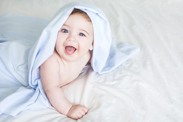newborn toddler boy laughing bed 115594 1502