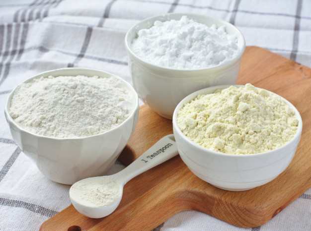 three bowls with gluten free flour rice flour millet flour potato starch spoon with xanthan gum 80013 2885