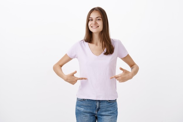 cute young sportswoman giving advices how stay fit smiling joyfully gazing friendly pointing t shirt belly standing delighted pleased with happy look grey wall 176420 23639